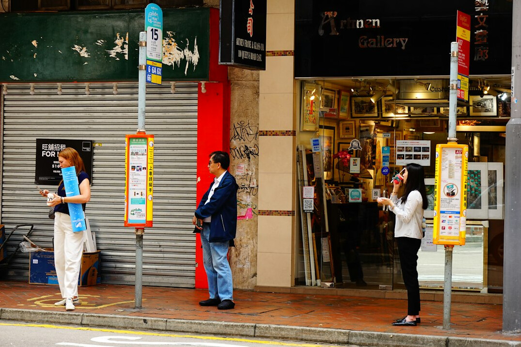 people waiting at bus stop