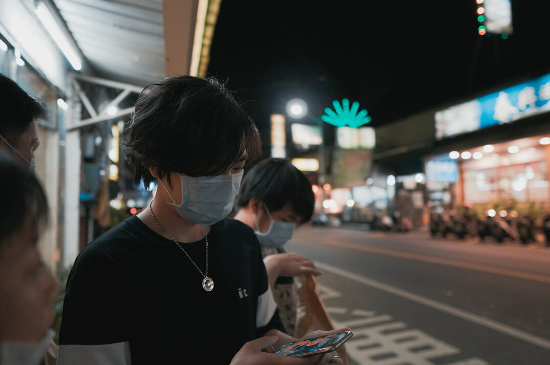 people waiting at bus stop
