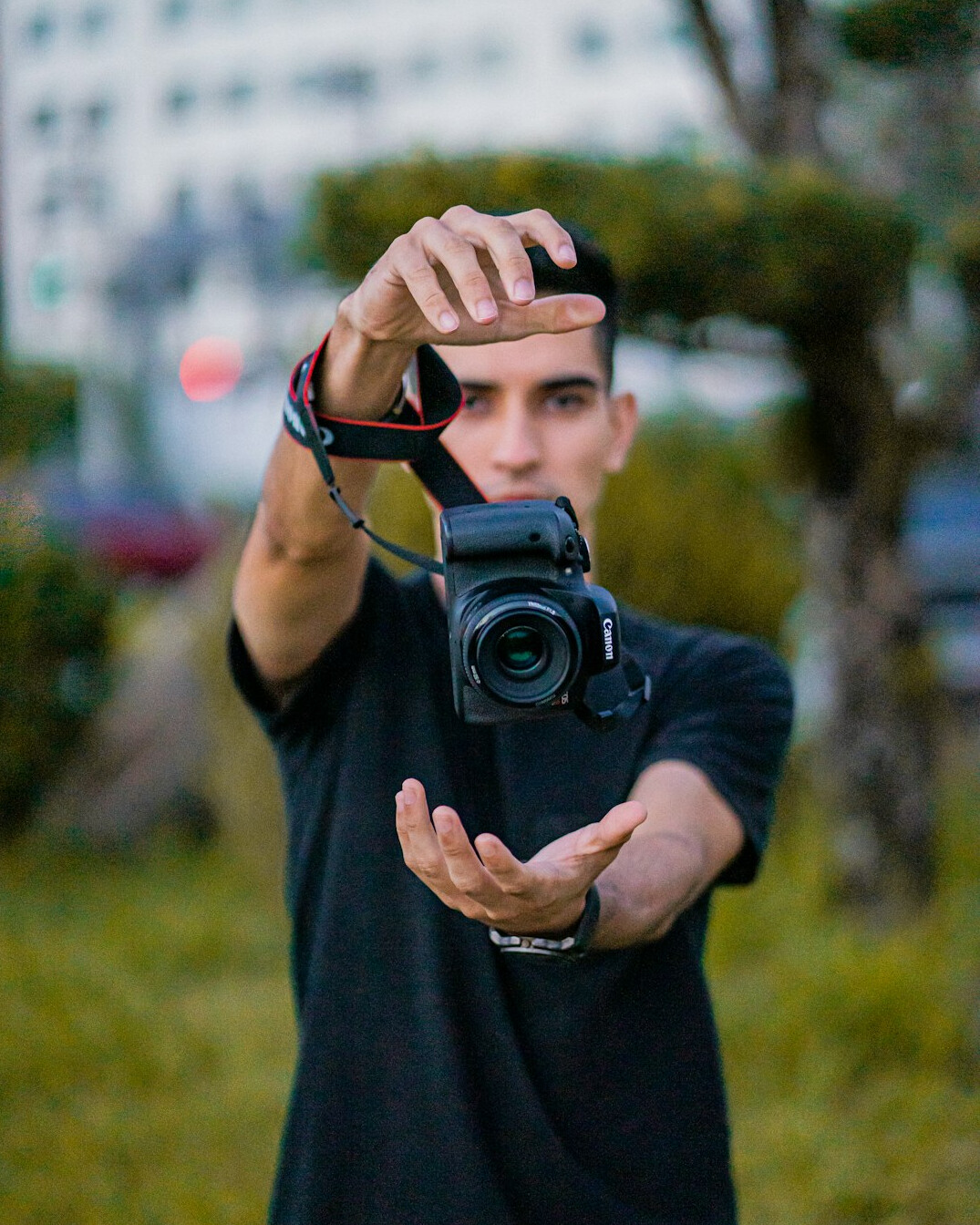 Portrait of a Chilean documentary photographer holding a camera