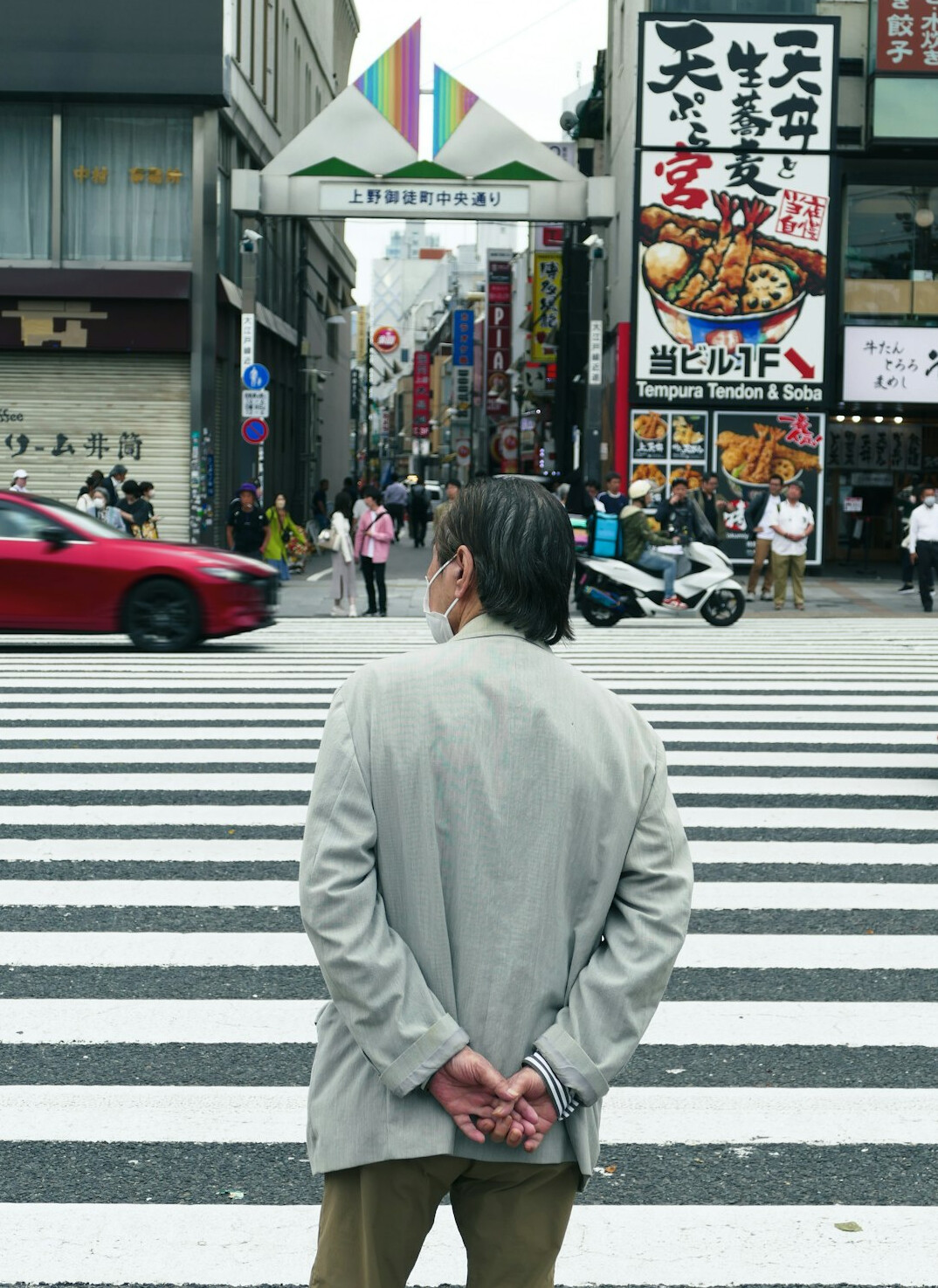 people waiting at crosswalk