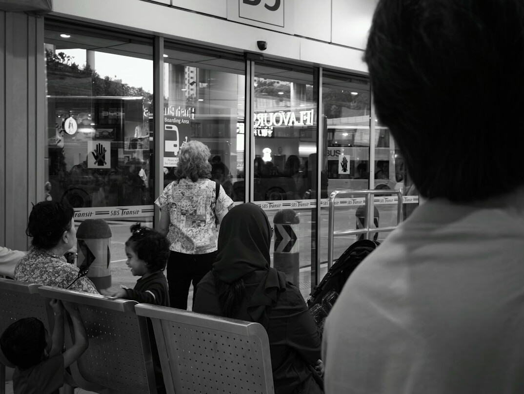 people waiting at bus stop