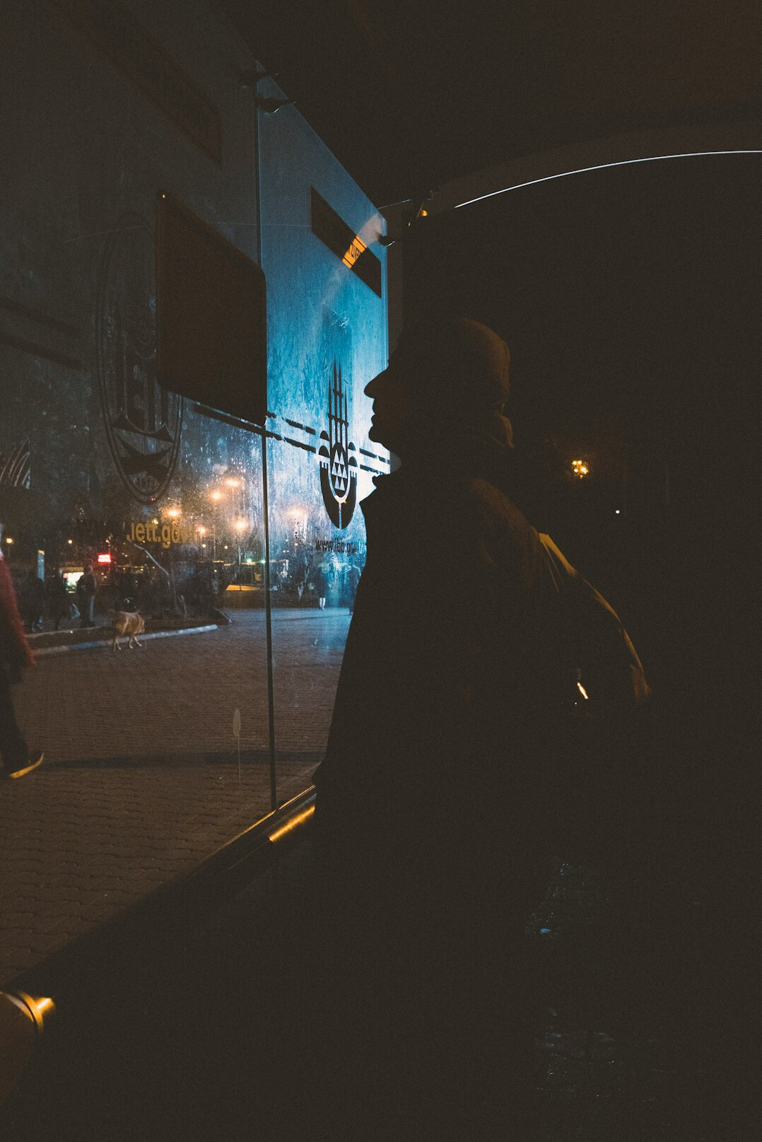people waiting at bus stop