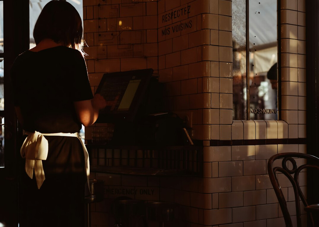 person waiting in line at cafe