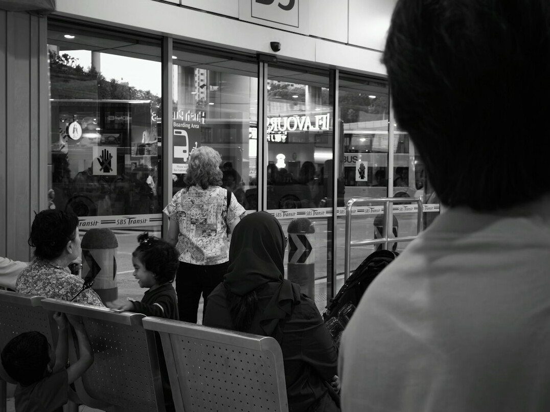 people waiting at bus stop