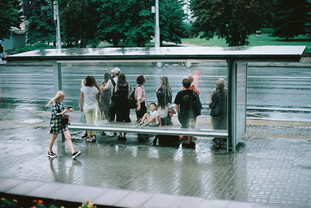 people waiting at bus stop